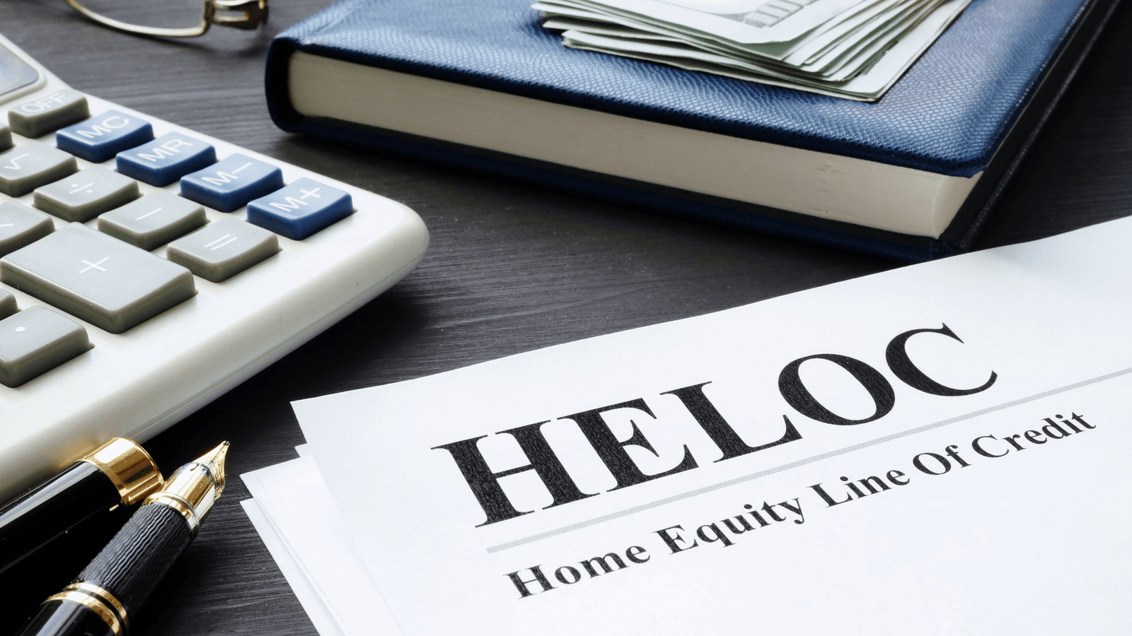 Homeowner reviewing documents with a mortgage lender while learning how to get a HELOC in 2026. Step by step guide covering home equity, application process, approval requirements, credit score, and home financing options.